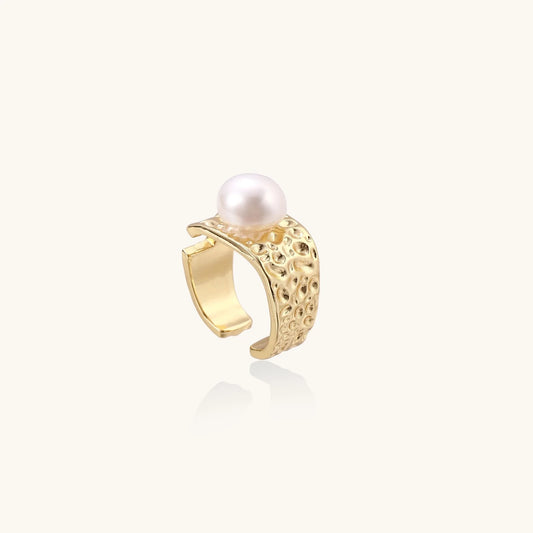 Wide gold-plated ring with organic textured band and white freshwater pearl centerpiece