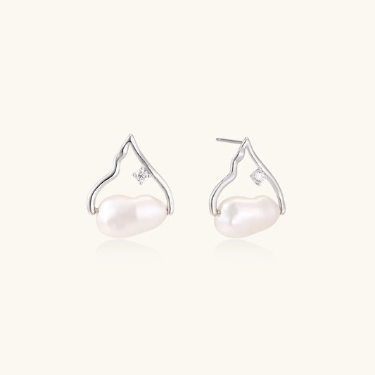 Silver mountain outline studs with baroque pearl and diamond accent on white background