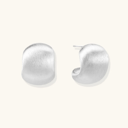 Brushed sterling silver cushion-shaped stud earrings with matte finish on white background