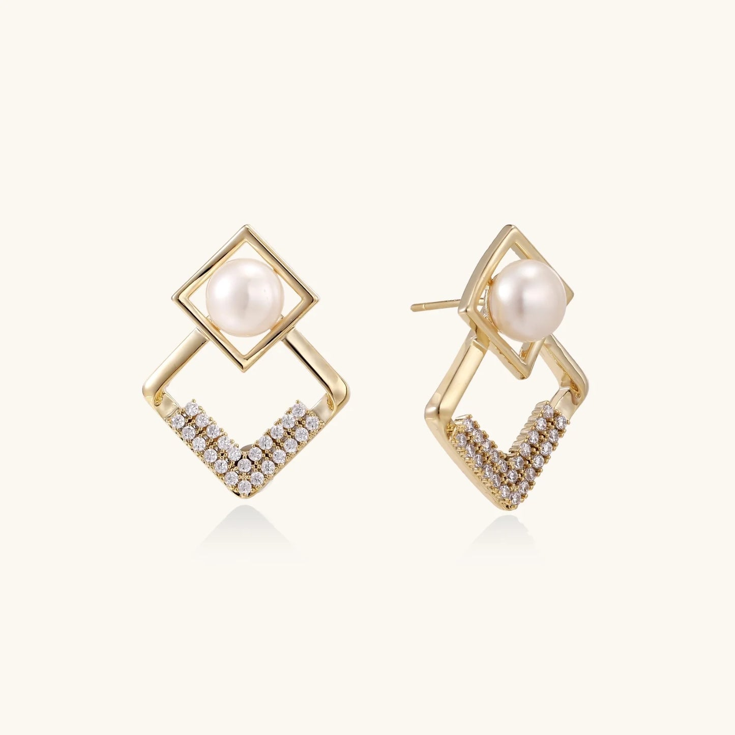 Gold-plated double square frame earrings with freshwater pearl and crystal accents on white background