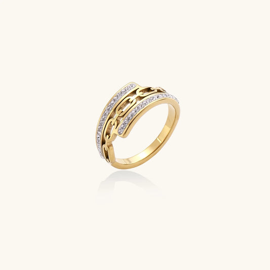 Gold-plated stainless steel ring with geometric chain link design flanked by two rows of clear rhinestones