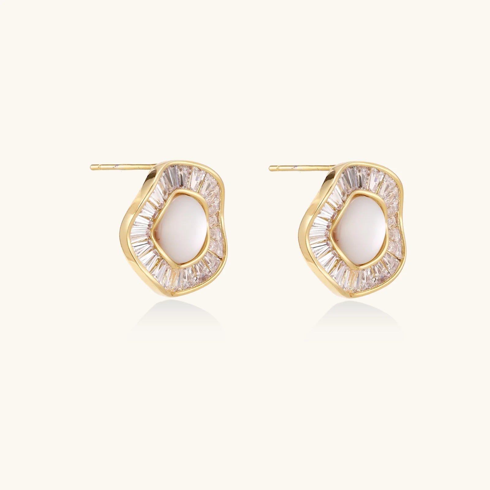14K gold-plated stud earrings with freshwater pearl center surrounded by baguette-cut crystal halo in sunburst design