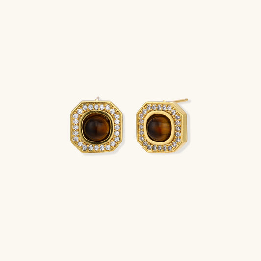 Gold-plated octagonal stud earrings with brown tiger's eye centers and cubic zirconia border on cream background.